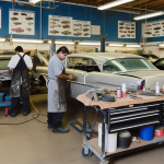 "Cars in a Professional Collision Repair Workshop with Technicians Expertly Restoring Vehicles to Pre-Collision Glory"